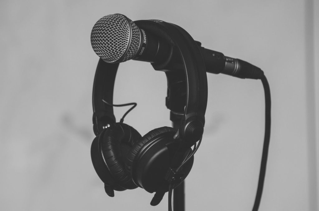 Photo by Barthy Bonhomme on <a href="https://www.pexels.com/photo/black-headset-hanging-on-black-and-gray-microphone-185030/" rel="nofollow">Pexels.com</a>