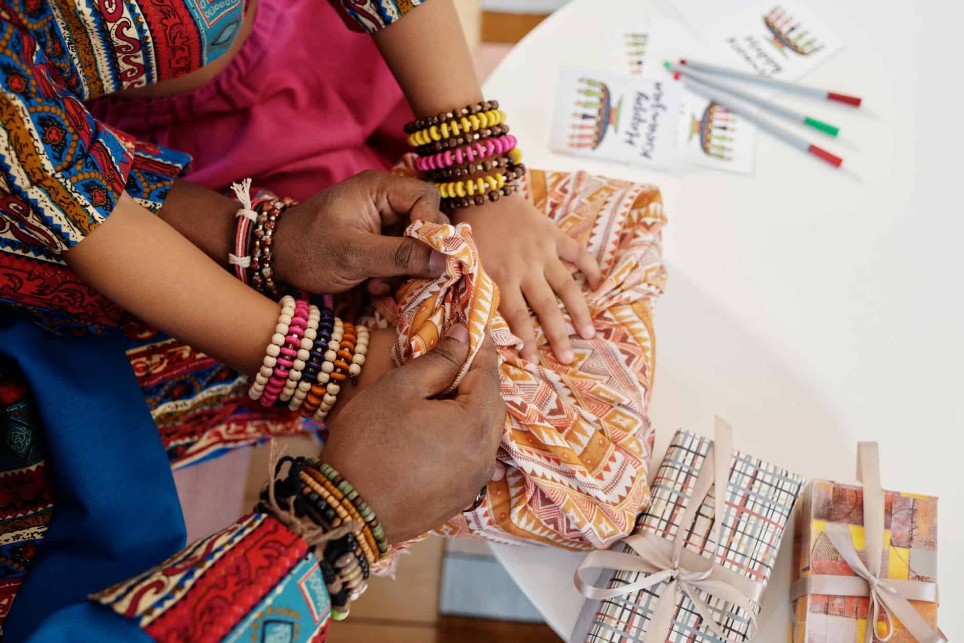 photo of hands on top of gift wrapped in a cloth