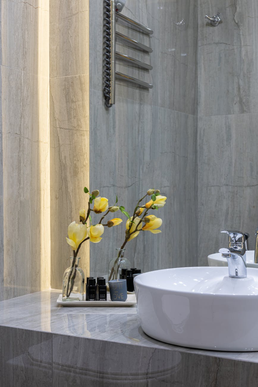 sink with flower in bathroom